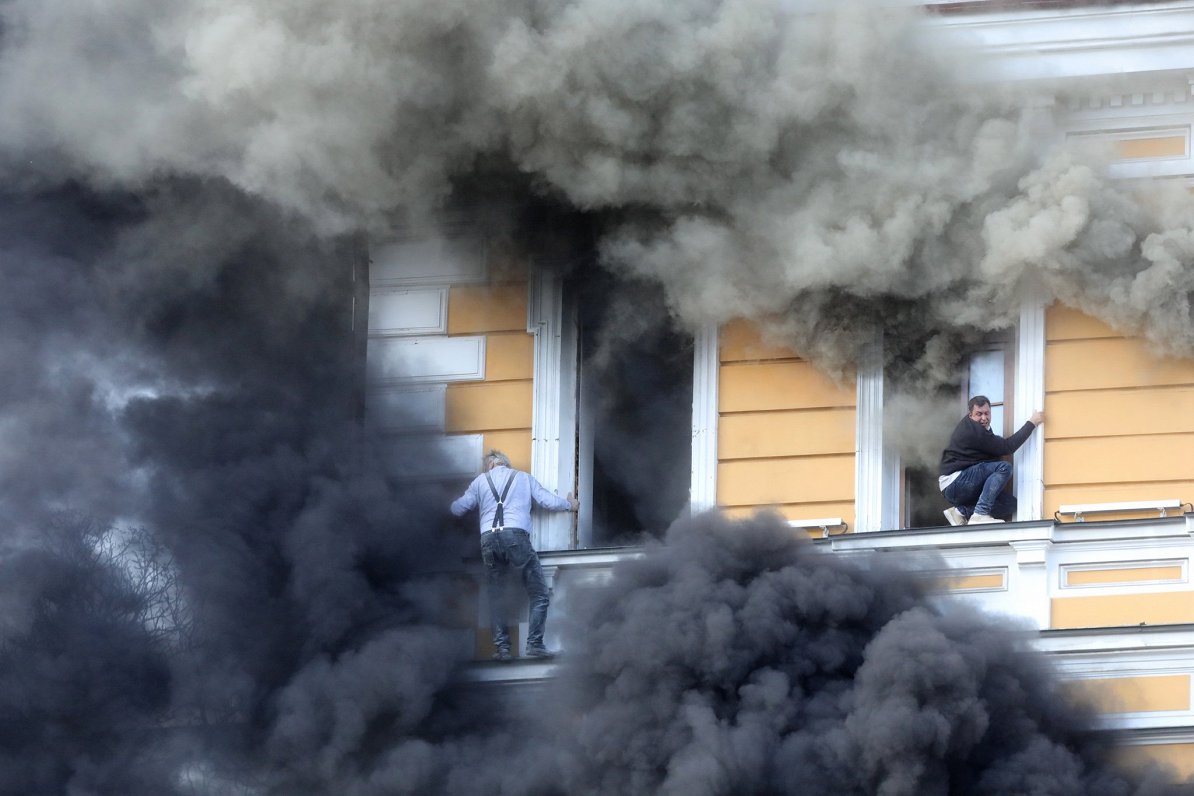 Smoke pouring from the damaged Presidium building in Kyiv